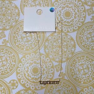 Capricorn gold colored chain